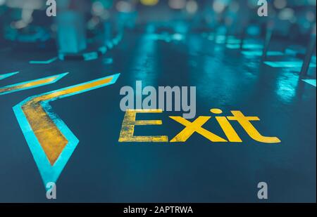 Exit background, big yellow arrow to exit from subway, direction sign, conceptual image of the way out, urban life, modern underground system Stock Photo