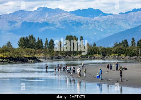 Silver salmon fishermen fish in Portage Creek in the Portage Valley, South of Anchorage, South-central Alaska; Alaska, United States of America Stock Photo