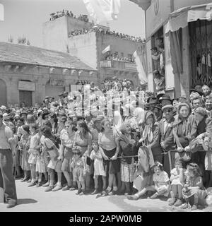 Israel 1948-1949: Jerusalem  Jerusalem. Audience during the military parade on May 15, 1949 on the occasion of the first anniversary of Israel's independence Date: 23 Apr 1950 Location: Israel, Jerusalem Keywords: pharmacies, architecture, banking, children, military parades, national holidays, public, billboards Stock Photo