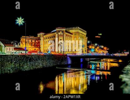 Night view of ex Sarajevo City Hall and National Library, known as Vijecnica, newly decorated and painted,renovated.SARAJEVO, BOSNIA and HERZEGOVINA, Stock Photo