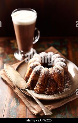 Marble up side down cake. Concept for a tasty Easter cake. Wooden background. Stock Photo