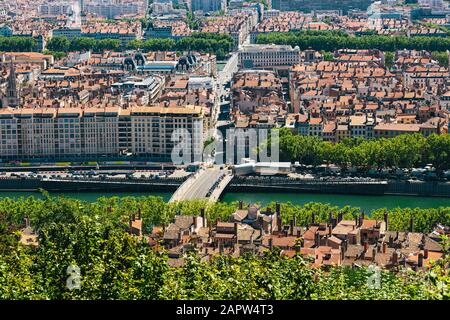 Lyon panorama elevated view on sunny day. Aerial panoramic view of Lyon with the skyline. Top view of Lyon cityscape with Pont Marechal Juin and Rhone Stock Photo