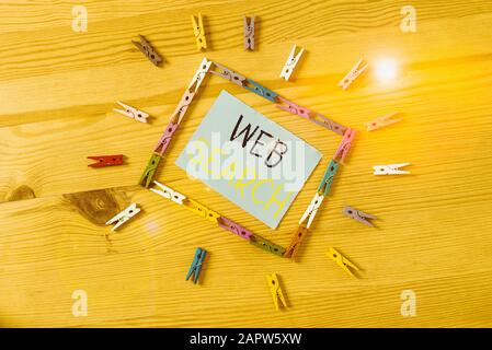 Word writing text Web Search. Business photo showcasing software system designed to search for information on the web Colored clothespin papers empty Stock Photo
