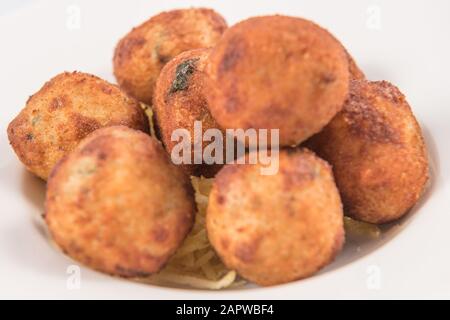 Salt Cod Croquettes balls with straw potatoes Stock Photo