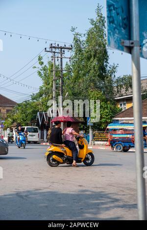 Morning traffic at the intersection of Kitsalat Road and Chaofa Ngum Road, Luang Prabang, Laos. Stock Photo