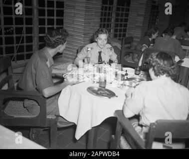 Photographs article Brothers Women's Corps KNIL  Meal at the Women's Corps KNIL Annotation: The man (2nd lieutenant) on the left appears on more photos in the collection and is probably from Army Contacts Service Date: January 1947 Location: Batavia, Indonesia, Jakarta, Dutch East Indies Stock Photo