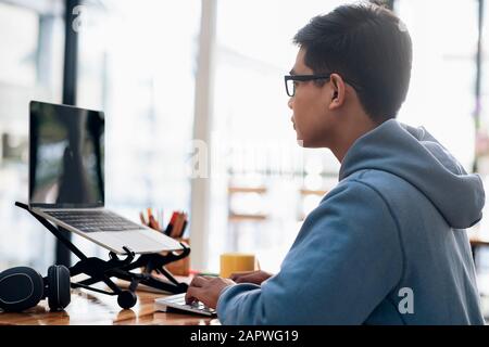Programmers and developer teams are coding and developing software. Stock Photo