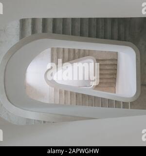 High angle view of a modern spiral staircase in an exhibition under the lights Stock Photo