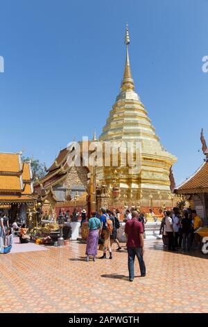 Tourists and locals visiting Wat Doi Suthep during a sunny day Stock Photo