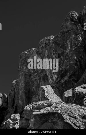 Vertical grayscale shot of a mountain Stock Photo