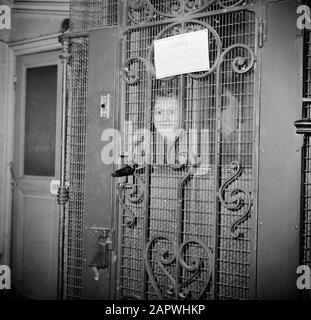 Residents of an apartment building in Paris  Girl standing in the elevator Date: 1950 Location: France, Paris Keywords: faces, elevators Stock Photo