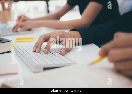 Programmers and developer teams are coding and developing software. Stock Photo