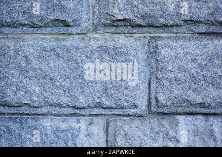 Closeup shot of a grey brick wall with rectangular tiles Stock Photo