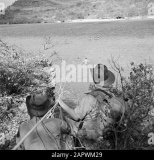 Journey to Suriname and the Netherlands Antilles  Soldiers on patrol in the Fuik Bay on Curaçao Date: 1947 Location: Curaçao Keywords: military Stock Photo