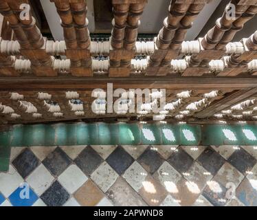 High angle shot of a patterned floor and a wooden structure attached to it Stock Photo