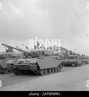 Independence Day (May 15). Military unit with tanks passes through the stands on which prominent figures take the military parade Location: Israel Keywords: military parades, national holidays, tanks, uniforms Institutional name: Independence Day Stock Photo