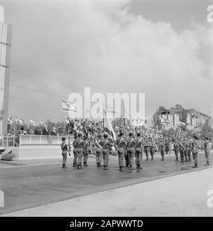 Independence Day (May 15). Military parade. In front of the stands with prominent figures, including President Ben Zvi and Prime Minister Ben Gurion, stand soldiers with banners Location: Israel Keywords: military parades, prime ministers, national holidays, presidents, uniforms, flags Personal Name: Ben Gurion, David, Ben Zwi, Isaac Institution name: Independence Day Stock Photo