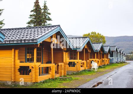 View of Classical Norwegian Camping site with traditional wooden red cottages, Northern Norway Stock Photo