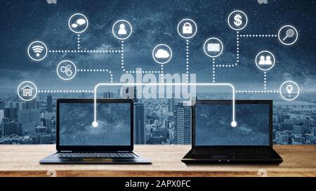 laptop computers with network connection and sharing data to other devices. Internet networking and connection Stock Photo