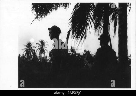 State formation Indonesia: Land War. - Mi. - Yeah.  Police actions Indonesia: pair of men on patrol on a forwarded post Annotation: Photo found in folder. Was not scanned by BvdT Location: Indonesia, Dutch East Indies Keywords: governance, borders, constitutions, statemaking Stock Photo