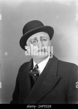 Portrait of a man with a monocle and a cigar Date: 1932 Keywords: hats, men, monocles, portraits, cigars Stock Photo