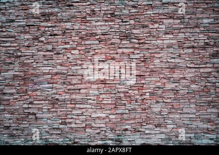 Abstract Irregular Red Color Brick Wall Patterns as Background or Textures Stock Photo