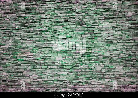 Abstract Irregular Green Color Brick Wall Patterns as Background or Textures Stock Photo
