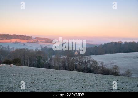 Early morning frost at sunrise across the Abbotswood estate in autumn. Stow on the wold, Cotswolds, Gloucestershire, England Stock Photo