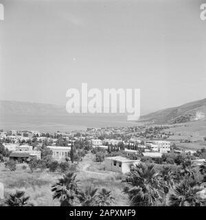 Israel 1948-1949: Tiberias  Tiberias. View of the city and lake with the surrounding mountains Date: 1948 Location: Galilee, Israel, Lake Tiberias, Tiberias Keywords: mountains, lakes, palm trees, panoramas, cities Stock Photo