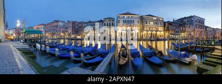 Blue gondolas on the Grand Canal, evening mood, illuminated, panorama, Venice, Italy Stock Photo