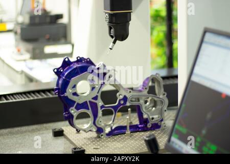 Blurred picture of aluminum machined parts inspected dimension by CMM ; Engineering industrial background Stock Photo