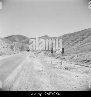 Between Amman and Jerusalem  Road with sign indicating that people are at sea level Annotation: At the time of the recording this place was in Jordan Date: undated Location: Israel, Jordan, Judea Keywords: mountains, place signs, roads Stock Photo