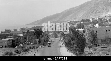 View of a part of the city of Tiberias with the surrounding hills and with a traffic road in the foreground. Israel, Lake Tiberias, Tiberias.; Stock Photo