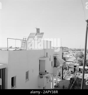 Solar panels on the roof of a dwelling for heating water Date: January 1, 1960 Location: Israel Keywords: architecture, energy supply, water, homes, solar panels Stock Photo