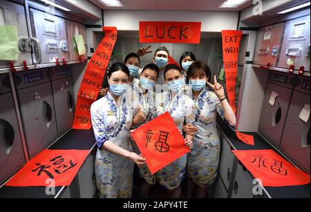 Beijing, China. 25th Jan, 2020. Flight attendants pose for a photo on flight HU7181 of Hainan Airlines on the Lunar New Year's Eve, Jan. 25, 2020. Credit: Guo Cheng/Xinhua/Alamy Live News Stock Photo