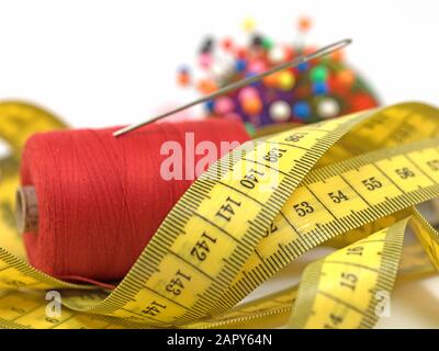 Sewing utensils against white background Stock Photo