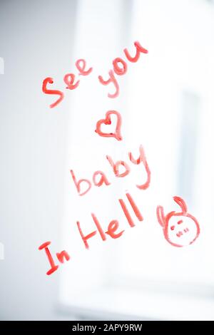 Message for lover and small heart drawn with red lipstick on mirror Stock Photo