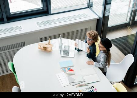 Creative little designers using touchpad while looking for online data Stock Photo
