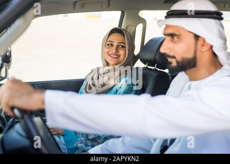 Beautiful middle eastern couple driving a car Stock Photo