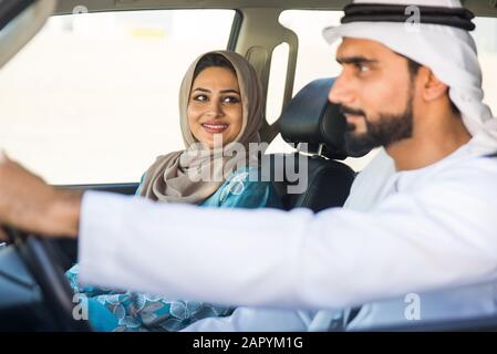 Beautiful middle eastern couple driving a car Stock Photo