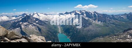 Panorama of Schlegeis glacier and beautiful blue lake in the mountains of Tirol, Austria Stock Photo