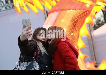 Belgrade, Serbia. 24th Jan, 2020. Visitors take a selfie with a light installation during the second Chinese Festival of Lights at the Kalemegdan fortress in Belgrade, Serbia, Jan. 24, 2020. The countdown to Chinese New Year was staged at the Kalemegdan fortress in Belgrade where citizens gathered to enjoy the second Chinese Festival of Lights together on Friday with Serbian government and embassy officials. The arrival of the Chinese lunar year was marked by fireworks the moment when Beijing was 12: 00 a.m. midnight. Credit: Shi Zhongyu/Xinhua/Alamy Live News Stock Photo