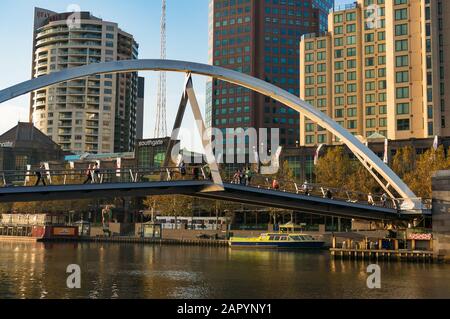 Melbourne, Australia - April 20, 2017: Evan Walker, or Southbank Pedestrian bridge with people walking Stock Photo