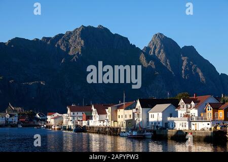 Rorbu, traditional fishing huts in village under the mountains on Lofoten Islands, Norway, Europe Stock Photo