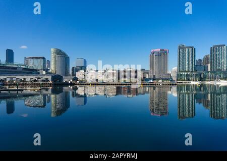 Waterfront cityscape on sunny day. Docklands neighbourhood, Melbourne, Australia Stock Photo