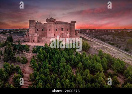 Aerial view of Belmonte castle in Cuenca Spain with circular walls, six towers and tower of homage, brick facade gallery and castle gates with dramati Stock Photo