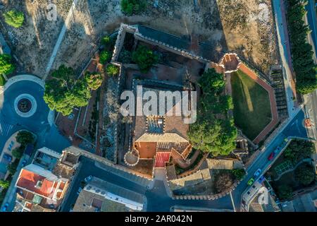 Aerial morning view of fully restored Besano castle in Valencia with battlements, towers and a keep in Spain Stock Photo