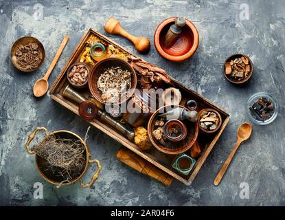 Chinese herbal medicine.Dried medicinal herbs, plants and rhizomes in a box Stock Photo