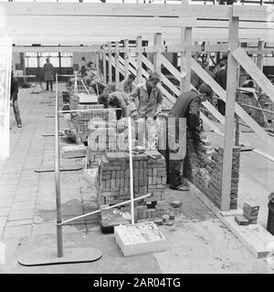 Masonry competition for the Golden Trowel in Rotterdam Date: July 4, 1962 Location: Rotterdam, South-Holland Keywords: Troffles, bricklaying, competitions Stock Photo
