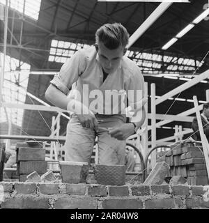 Masonry competition for the Golden Trowel in Rotterdam Date: July 4, 1962 Location: Rotterdam, South-Holland Keywords: Troffles, bricklaying, competitions Stock Photo